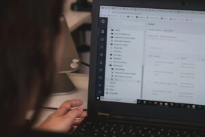 Founder writing at a desk in a small studio — brand voice for small organizations