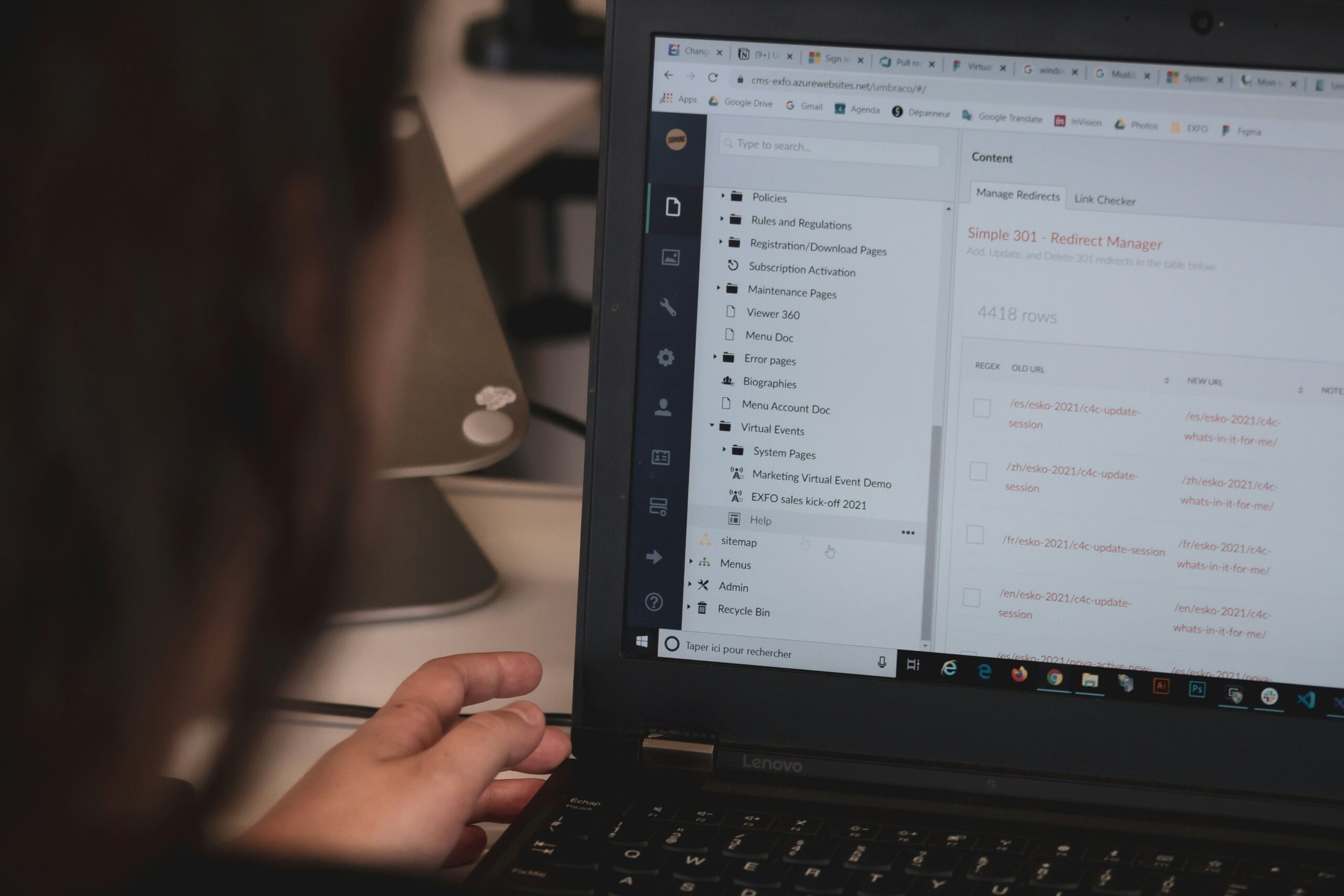 Founder writing at a desk in a small studio — brand voice for small organizations